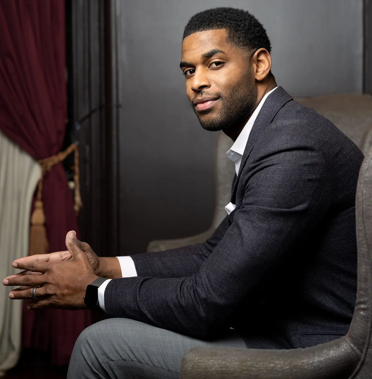 Marques Colston seated in an armchair